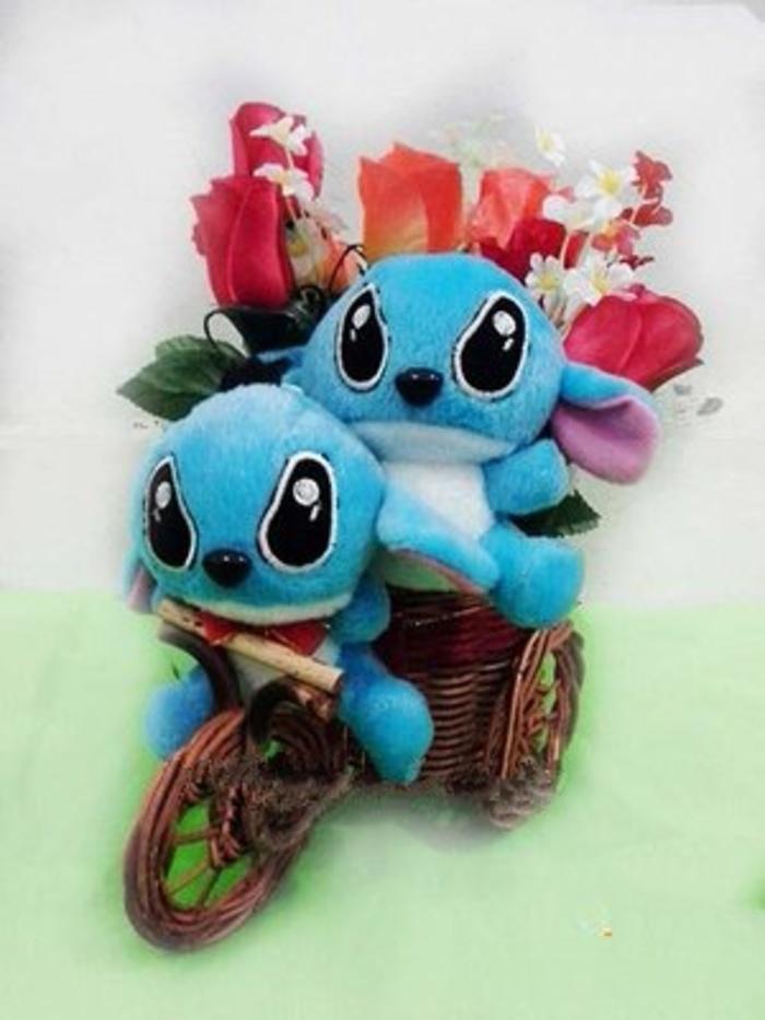BOUQUET BUNGA BONEKA STITCH NAIK SEPEDA ROTAN SIZE 28x14x20cm ( JTC )